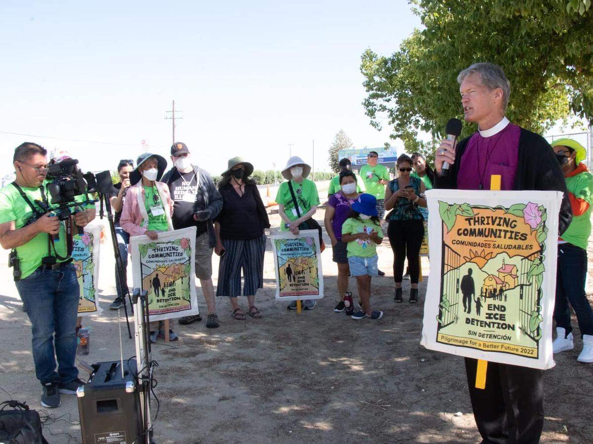 Bishop David Rice of the Episcopal Diocese of San Joaquin addresses people attending the Pilgrimage for a Better Future, an interfaith tour of various ICE detention centers on May 29, 2022 outside the Golden State Annex in McFarland.