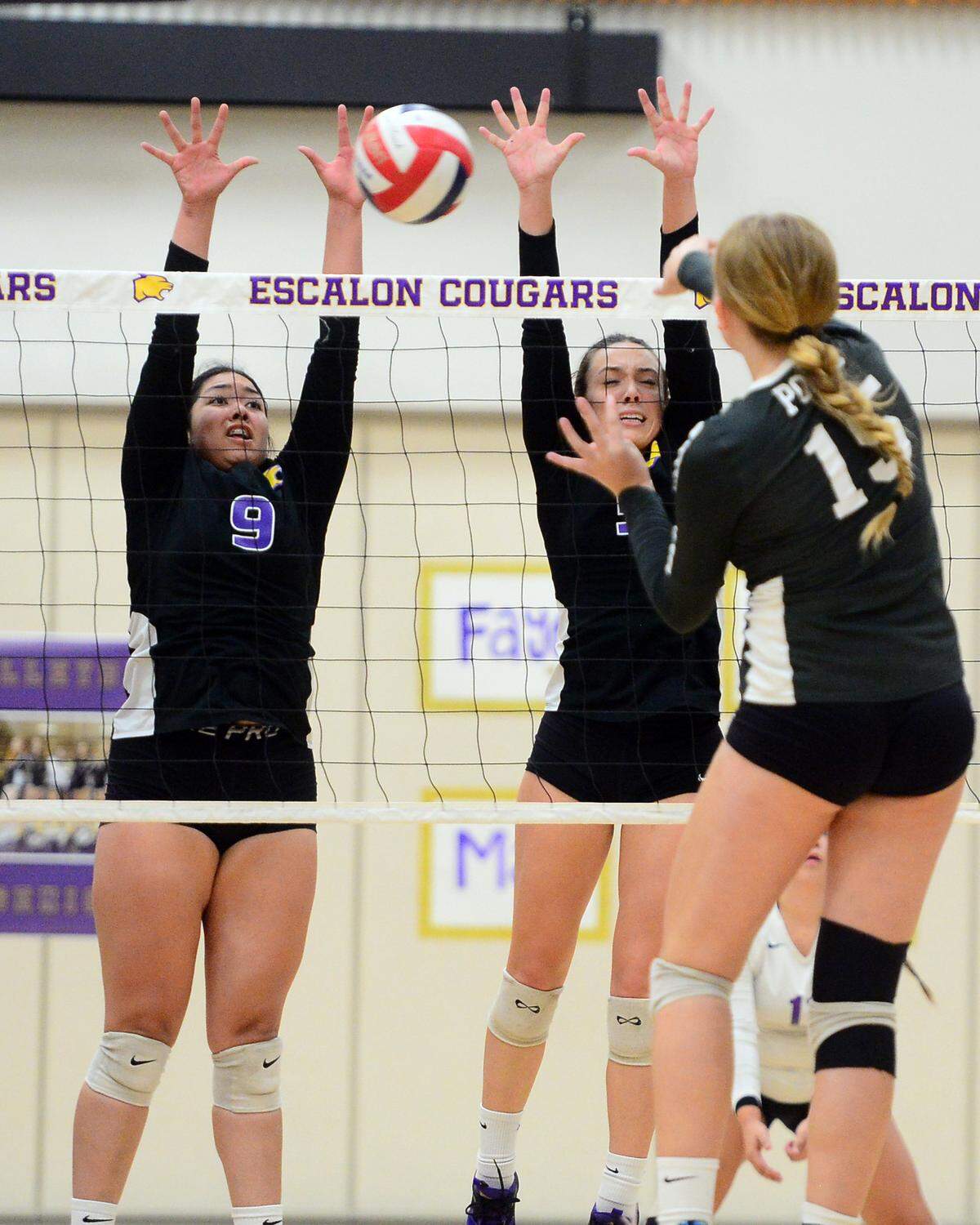 Escalon’s Lisa Murga (8) blocks the ball during a CIF San-Joaquin Division III Girls Volleyball Playoffs game between Escalon High School and Ponderosa High School at Escalon High School in Escalon CA on November 1, 2022. Escalon won the match 3-2.