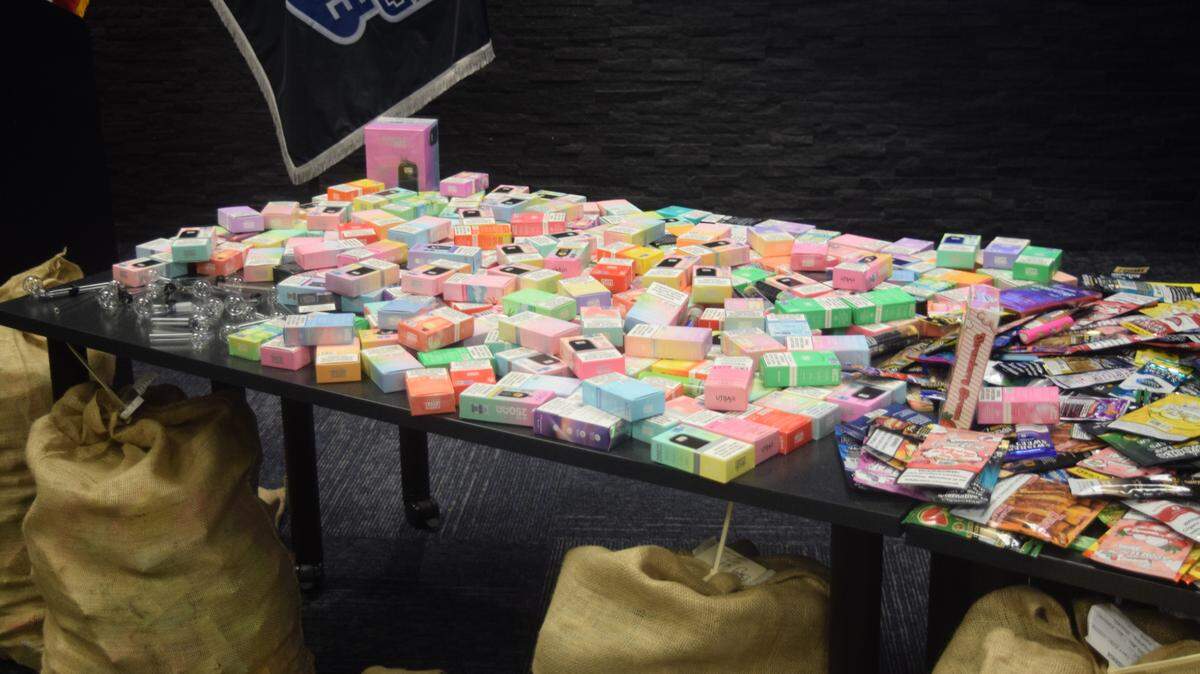 A table displaying flavored tobacco products, flavored vapes and meth pipes displayed during a Modesto Police Department press conference at their police station downtown on Oct. 18, 2024. 