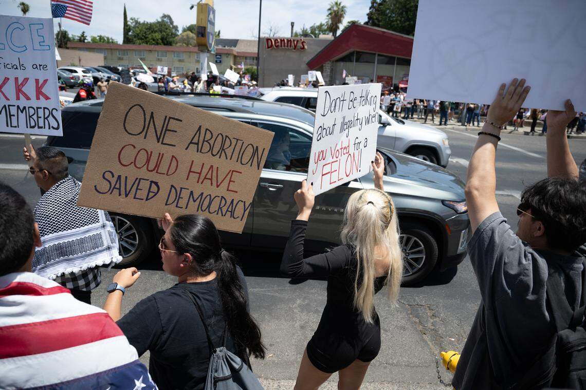 “No Kings” protestors rallied at Five Points to oppose Trump Administration policies at Graceada Park in Modesto, Saturday, June 14, 2025. 