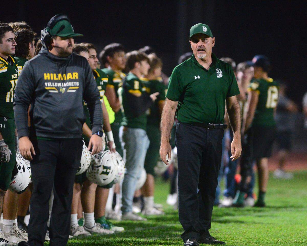 Hilmar Head Coach Frank Marques walks the sidelines during a game between Hughson High School and Hilmar High School at Hughson High School in Hughson CA on October 14, 2022.
