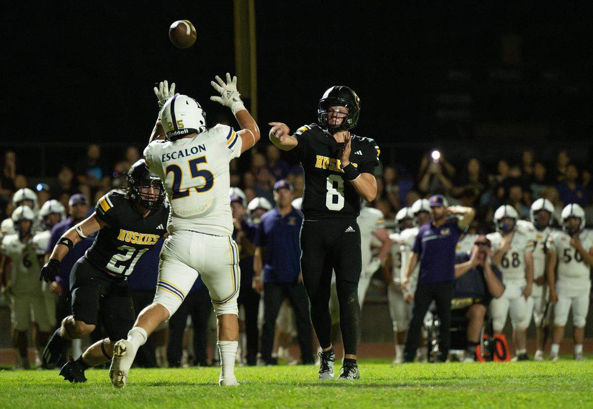 Hughson quarterback Robert McDaniel makes a pass during the Trans Valley League game with Escalon in Hughson, Calif., Friday, Oct. 4, 2024. 