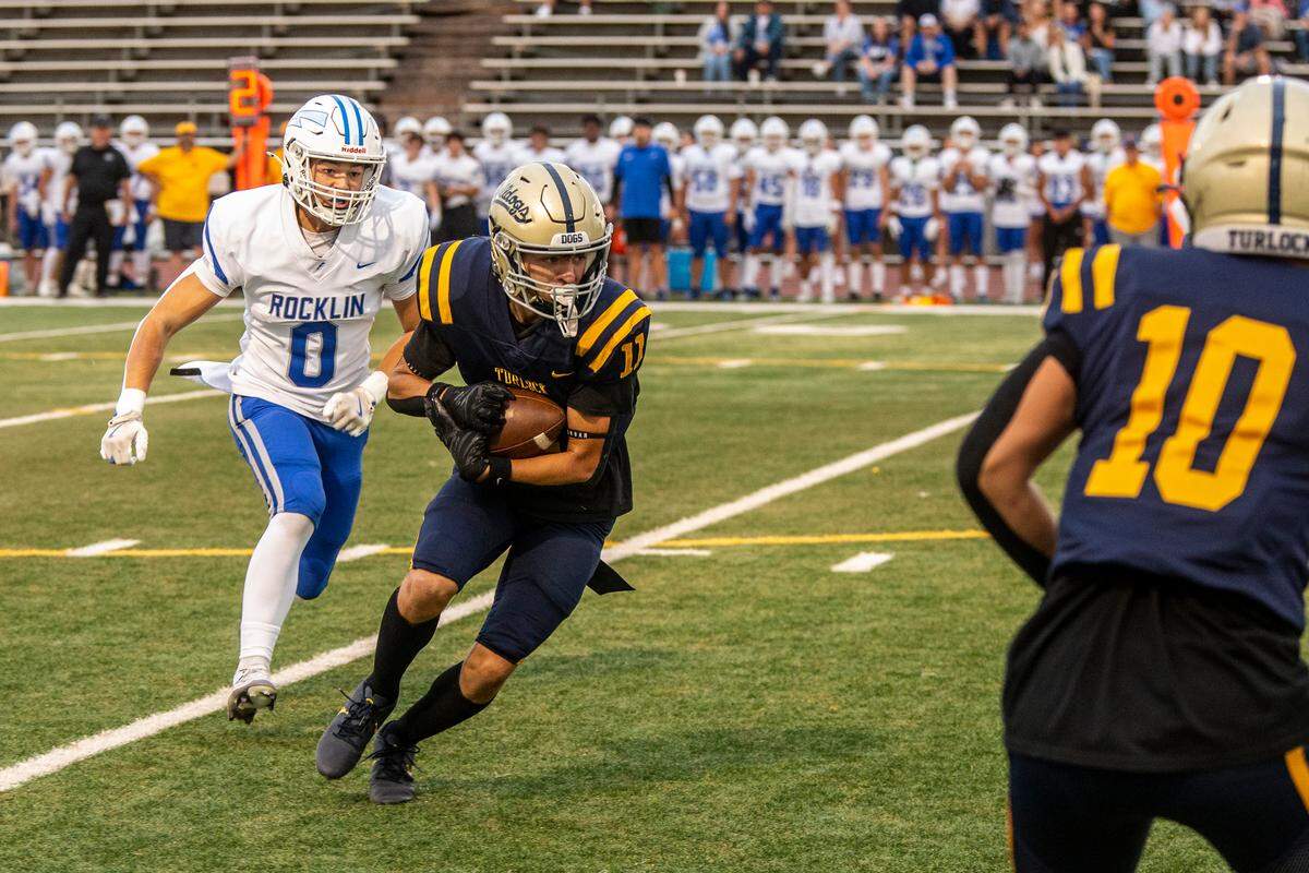 Landyn Fitzgerald, 11, of Turlock works his way up field as Mavrik Collins, 0, of Rocklin chases him down during the first half of their game at Turlock High Aug. 23, 2024.