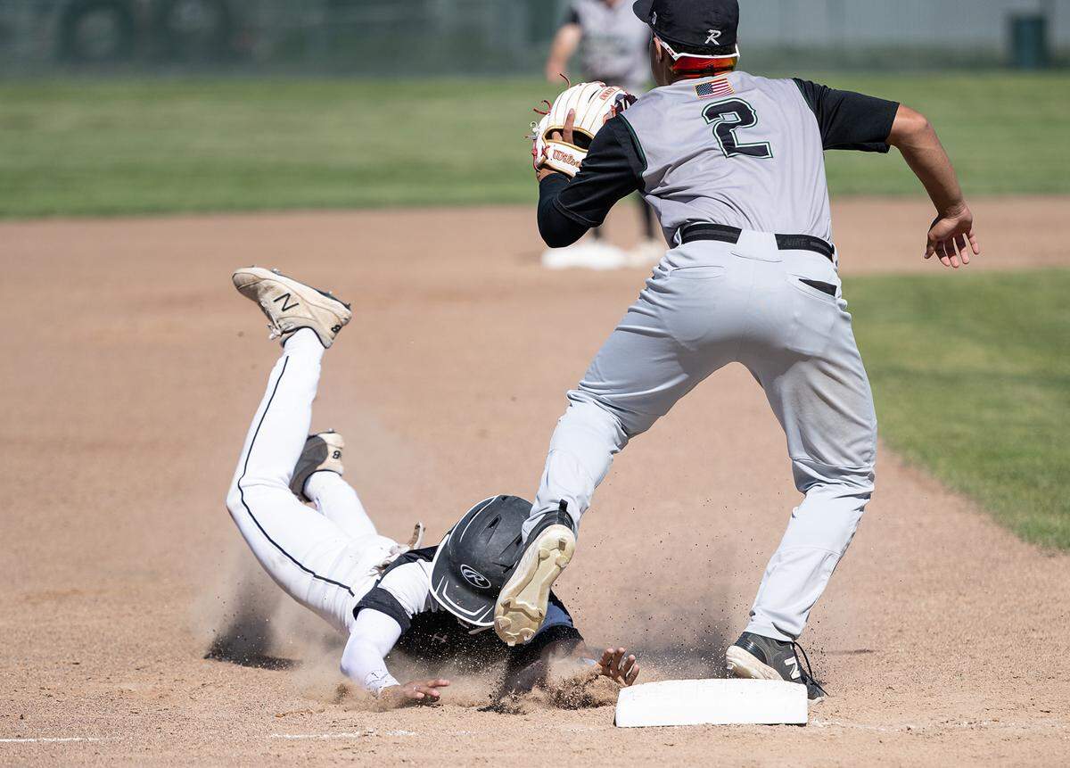 Pitman’s Cristian Jacinto takes third on a fly ball during Sac-Joaquin Section Division 2 baseball playoff game with Rodriguez at Pitman High School in Turlock, Calif., Thursday, May 11, 2023.