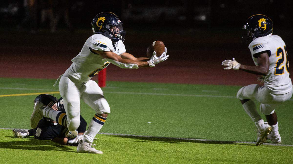 Gregori’s Ayden Powers intercepts a tipped ball during the Central California Athletic League game with Enochs at Downey High School in Modesto, Calif., Friday, Sept. 30, 2022.
