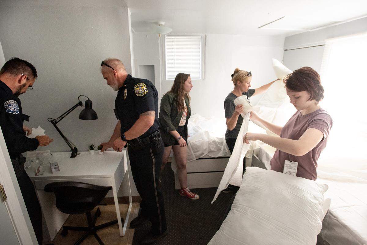 From the left, Modesto Police detective Sean Dodge, Turlock Police Lt. Neil Cervenka, Zoe Pope, Jillina Stevenson and Zoe Stevenson finish up the makeover of a bedroom in Modesto in Modesto, Calif., on Friday, June 3, 2022. MPD and other local law enforcement members remodeled six rooms for nine children in Modesto and Empire through 10K with a Cop and the Healthy Room Project.