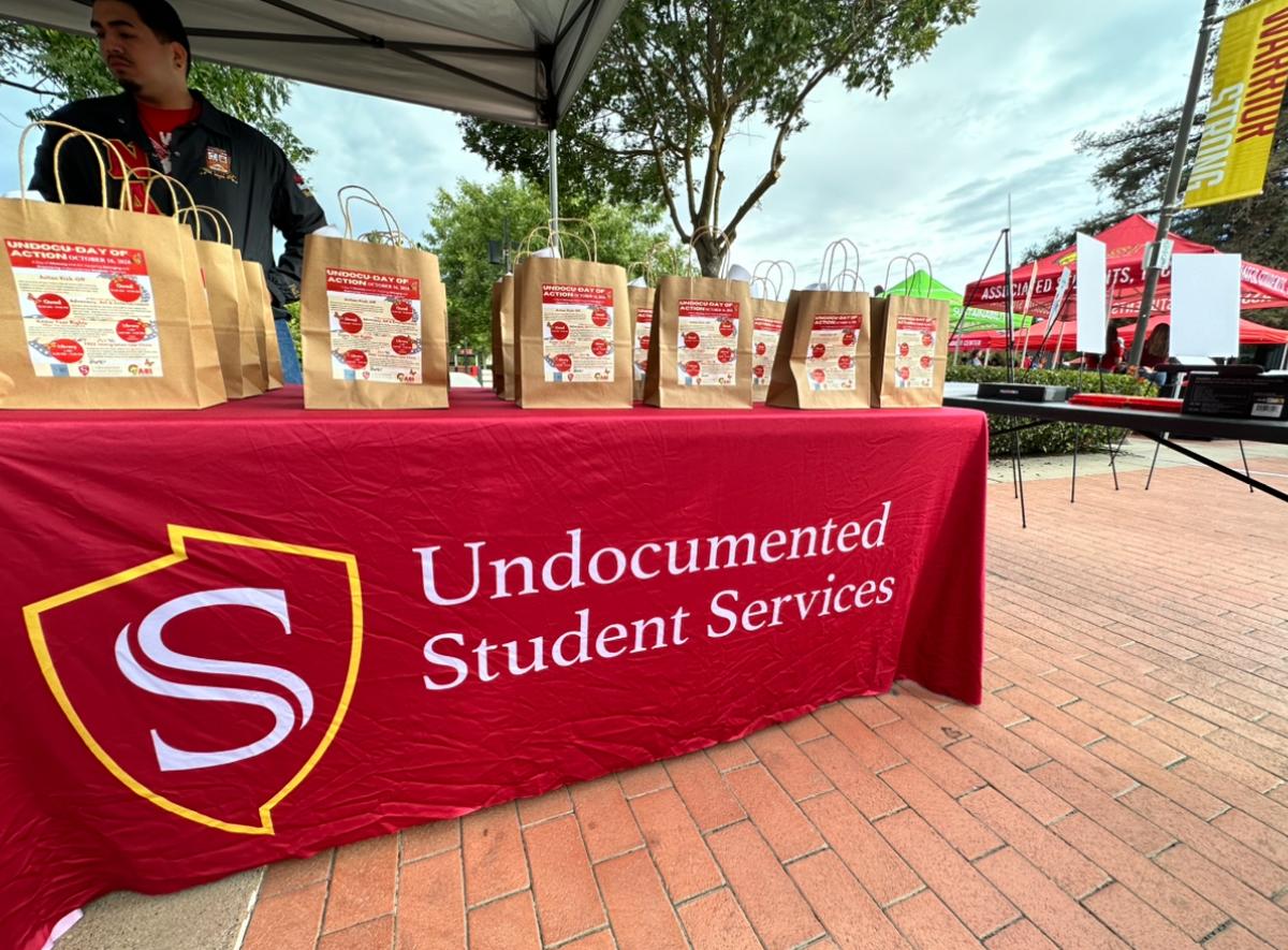 Undocumented Student Services hands out resources and flyers for “Undocu-Day of Action” at Stanislaus State’s quad on Wednesday, Oct. 16.