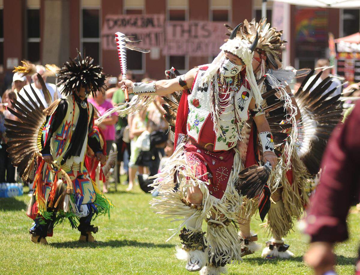 Dressed in full traditional regalia, Sacramento’s Percy Warcloud Edwards of the Colville Confederated tribe out of Washington, performs a dance along with other Native American dancers during the grand entry of the fifteenth annual Intertribal Pow Wow at MJC quad in 2013.