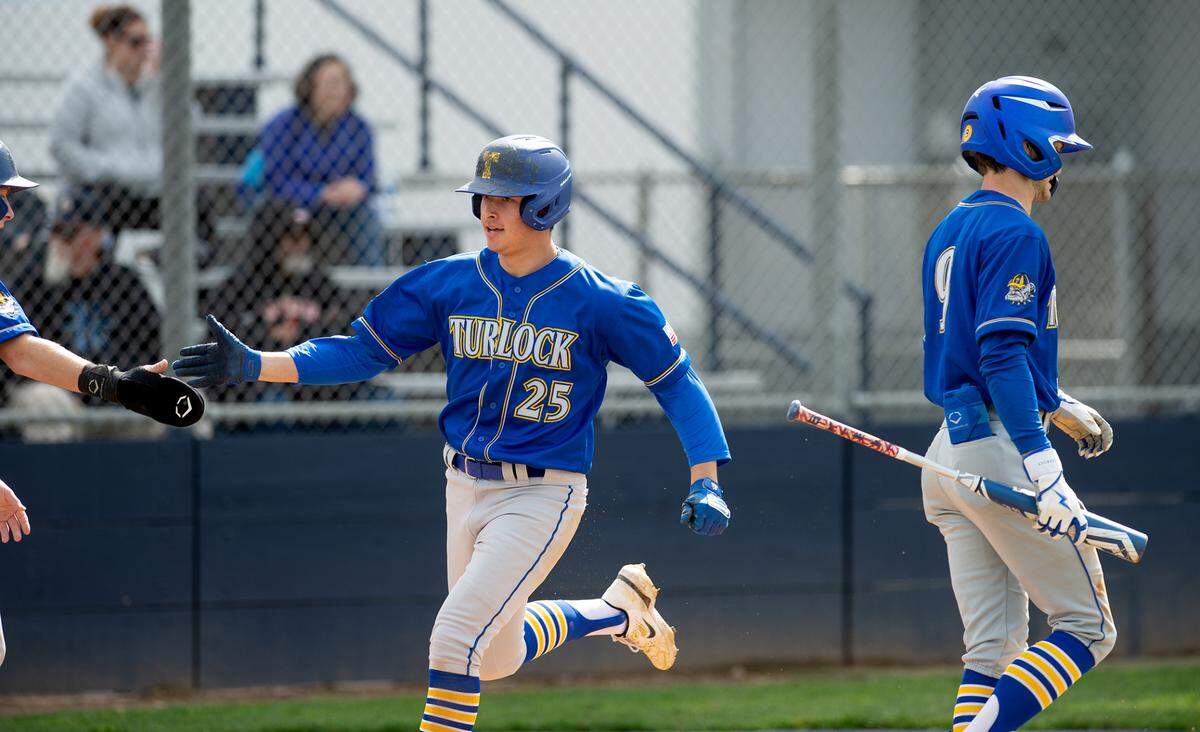 Turlock’s Carson Gonzales scores during the Central California Athletic league game with Downey at Downey High School in Modesto, Calif., Thursday, March 23, 2023. Turlock won the game 5-2.