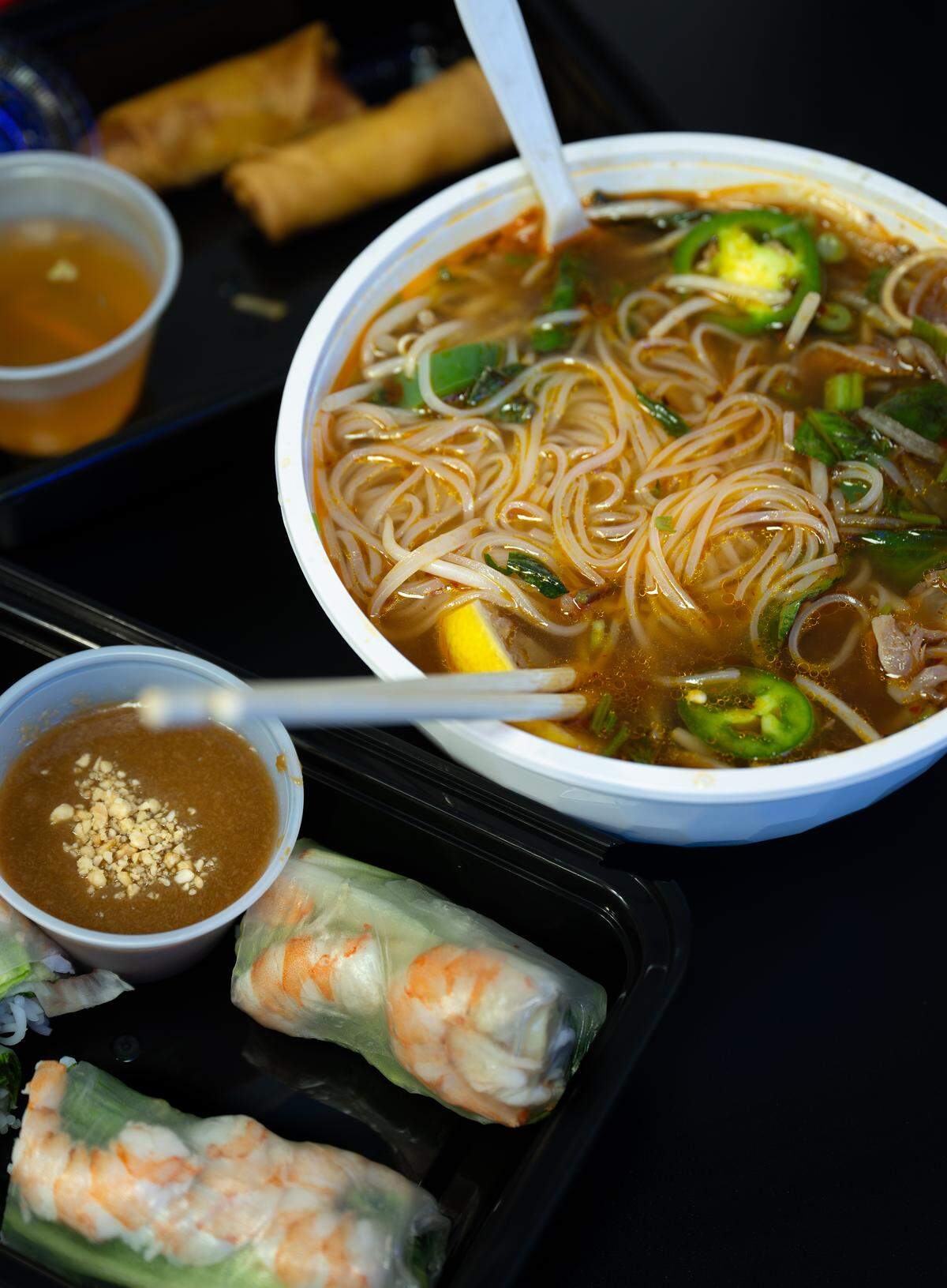 Pho with rare steak and well-done flank and shrimp spring rolls at Saigon-2 Vietnamese restaurant in Ceres.