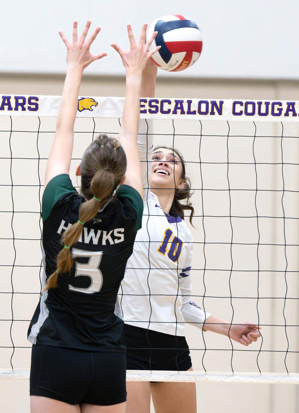Escalon’s Peyton Houser-Keaton hits past Liberty Ranch’s Vivian Frame during the Sac-Joaquin Section Division IV playoff match in Escalon on  Tuesday, Oct. 28, 2025. Escalon won the first-round match 3-0.