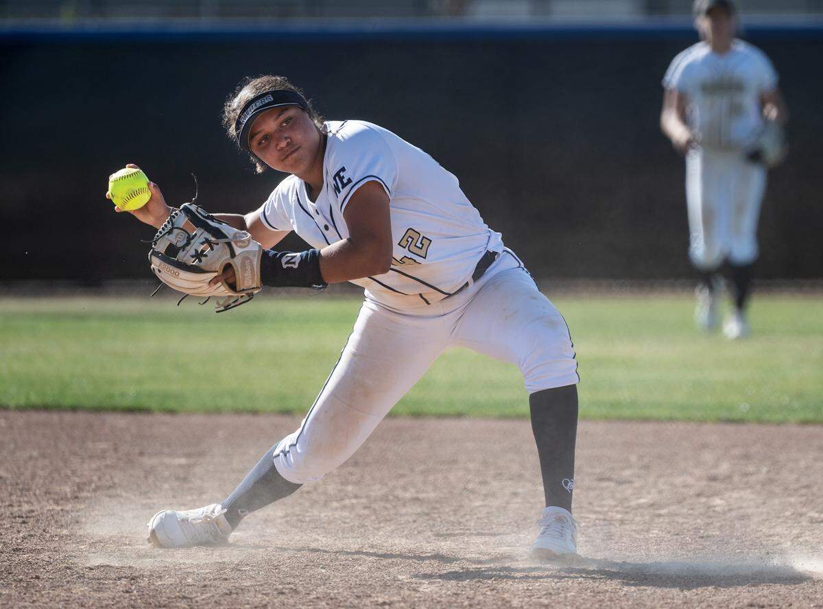 Central Catholic’s Jazmarie Roberts fields a ground ball and throws out a Merced runner during the CIF Sac-Joaquin Section Division III softball playoff game at Central Catholic High School in Modesto, Calif., on Thursday, May 19, 2022. Central Catholic won the game 4-1.