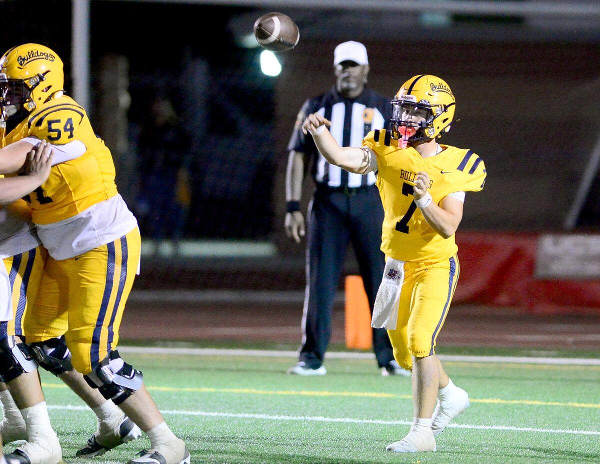 Turlock quarterback Scout Silva (7) throws a pass over the middle during the game with Sonora at Turlock High School on Sept. 12, 2025.