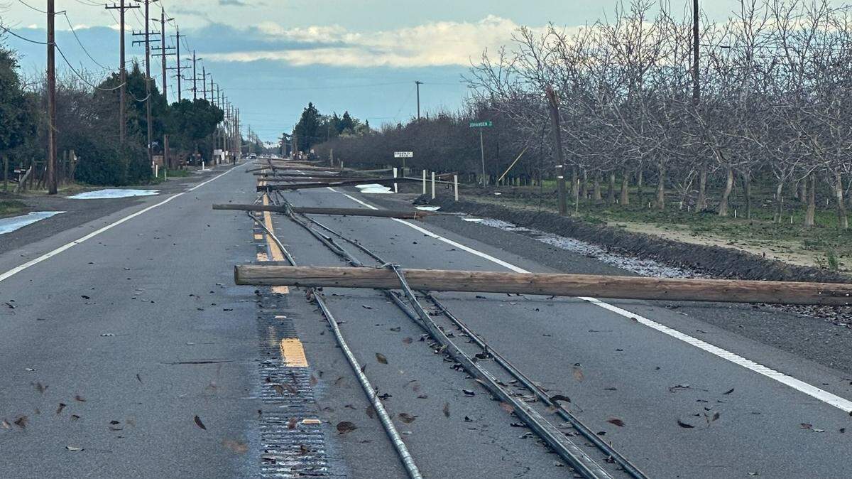 Phone poles and lines lie on Highway 132 east of Empire between Wellsford and Albers/Geer roads on Sunday afternoon, Feb. 4.