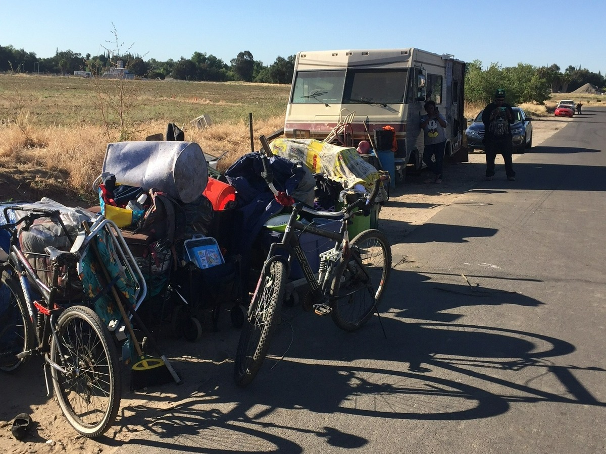 Stanislaus County personnel took action to remove squatters from a derelict residential parcel Monday, May 16 in southwest Modesto. About 15 people who were living illegally on the nuisance property began the process of registering for services.