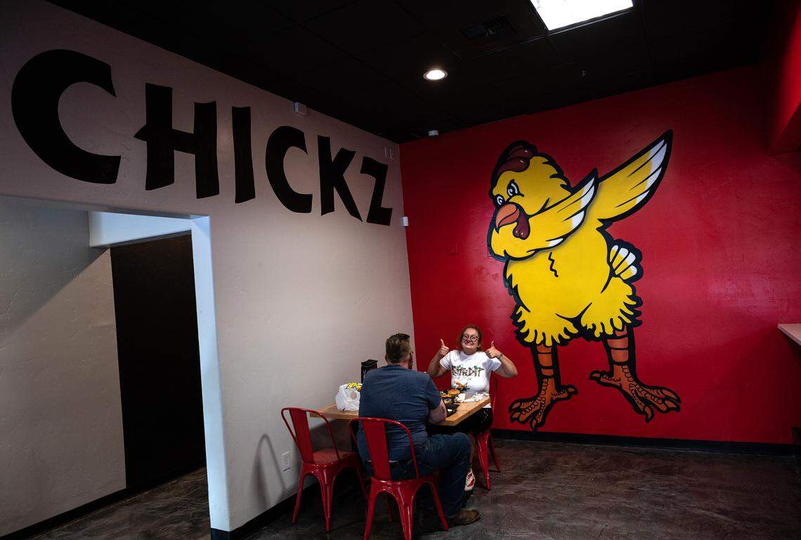 Alexa Golyamskaya gives the thumbs up after eating the x-hot chicken at Angry Chickz restaurant in Ceres, Calif., on Thursday, July 15, 2021.
