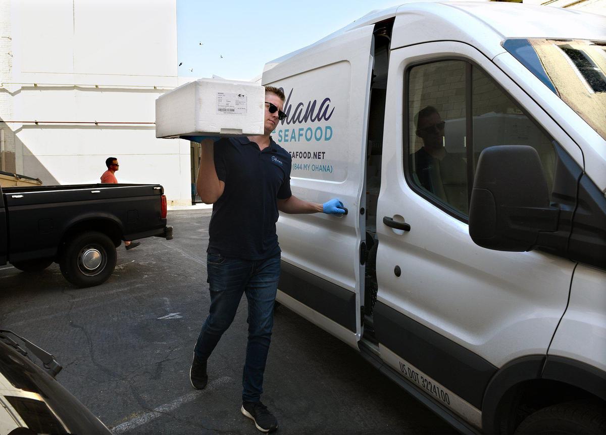 Jason Mensonides is pictured with a fish delivery on Thursday August 8, 2019 in downtown Modesto, Calif. The seafood distribution business Ohana Seafood provides fresh seafood to many of Modesto’s fine dining establishments.
