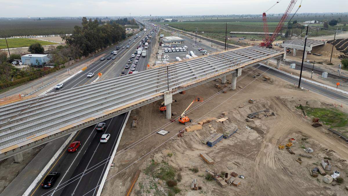 Construction work on a new bridge over Highway 99 at Austin Road continues in Manteca, Tuesday, Nov. 11, 2025.