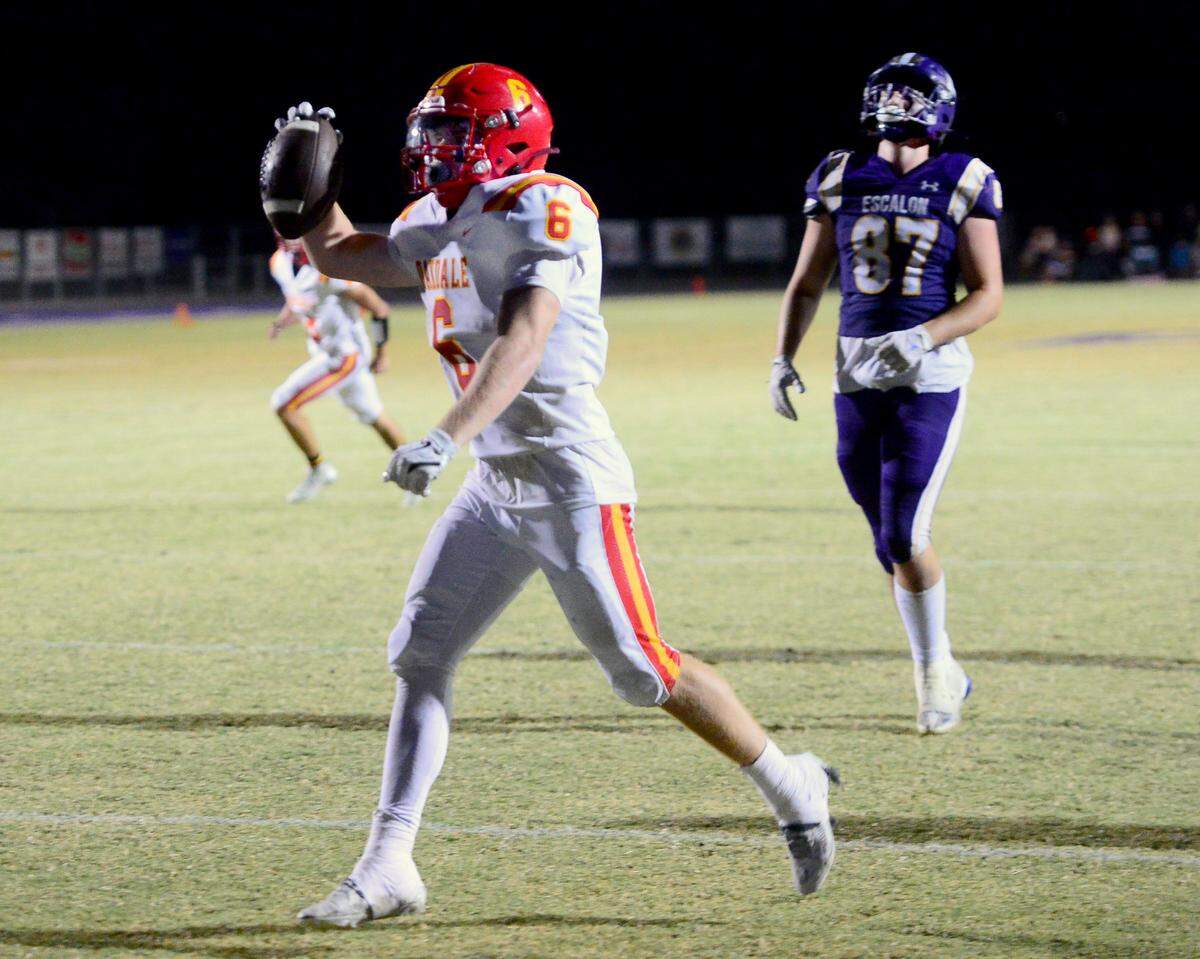 Oakdale running back Chase Lopez (6) scores a touchdown in overtime during a game between Escalon High School and Oakdale High School in Escalon, Calif. on Sept. 6, 2024. Oakdale won the game 21-20 in overtime.