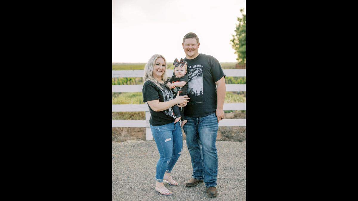 Modesto Police Officer Michael Rokaitis with his wife Megan and their 1-year-old daughter.