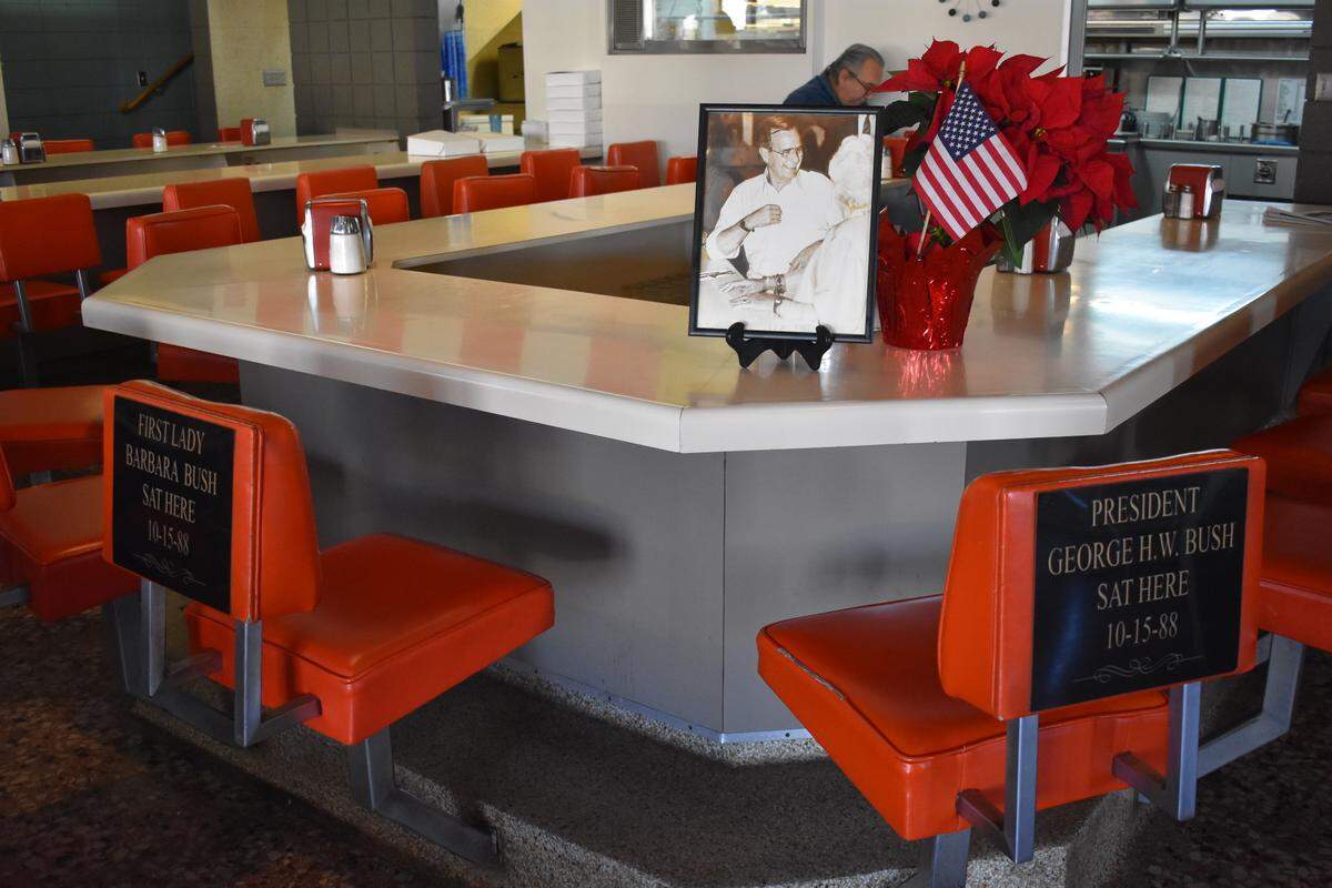 Plaques commemorate the seats used by then-Vice President George H.W. Bush and his wife, Barbara, when the presidential candidate and his entourage ate at Latif’s Restaurant during a stop in Turlock on Oct. 15, 1988.