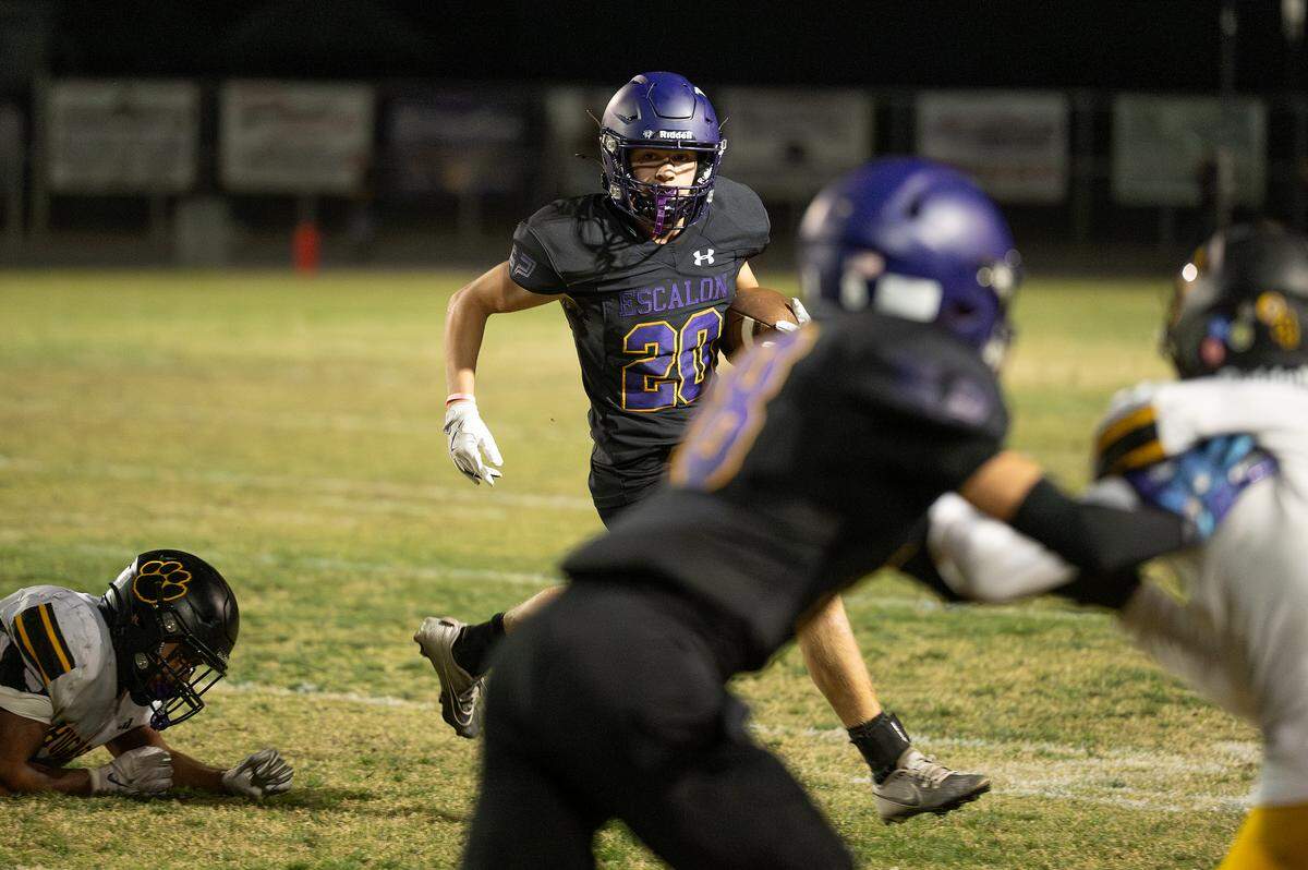 Escalon’s Jake Ferreira runs the ball during the Trans-Valley League game with Hughson at Escalon High School in Escalon, Friday, Oct. 3, 2025.
