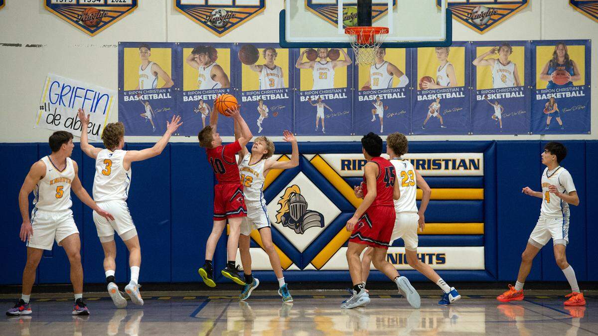 Ripon Christian’s Preston Zuidervaart (12) challenges Vacaville Christian’s Landen Graves during the Sac-Joaquin Section Division V semifinal game at Ripon Christian High School in Ripon, Calif., Wednesday, Feb. 22, 2023.