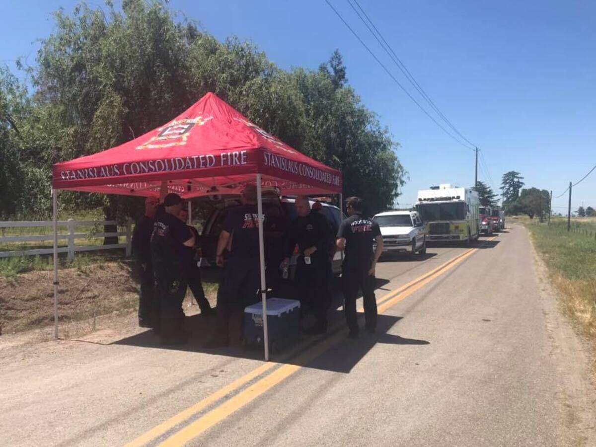 Authorities from Stanislaus County at the scene of the marijuana processing lab on Thursday April 25, 2019, in the 6200 block of Lon Dale Road near Oakdale, California.