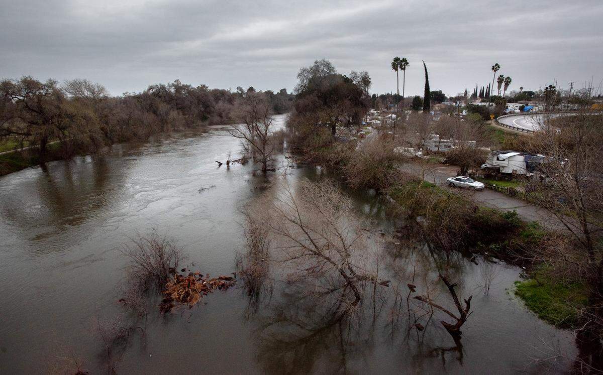 The Tuolumne River has swelled prompting an evacuation warning from the Stanislaus County Office of Emergency Services for those residents near the 9th Street bridge in Modesto, Calif., Thursday, March 9, 2023.
