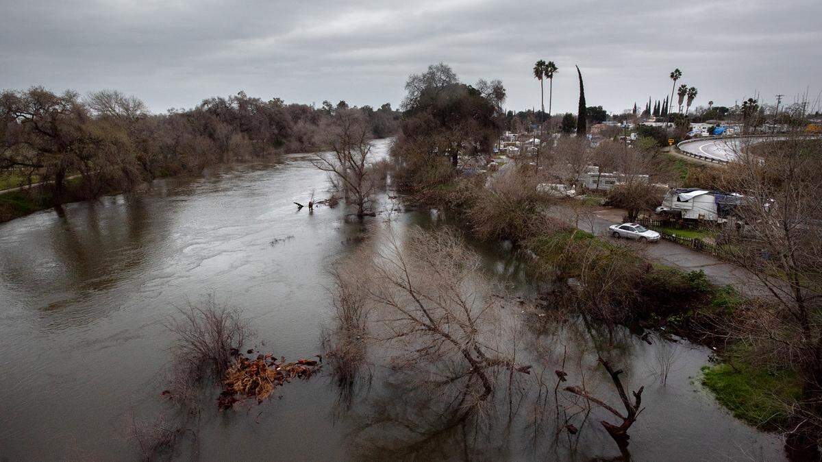 The Tuolumne River has swelled prompting an evacuation warning from the Stanislaus County Office of Emergency Services for those residents near the 9th Street bridge in Modesto, Calif., Thursday, March 9, 2023.