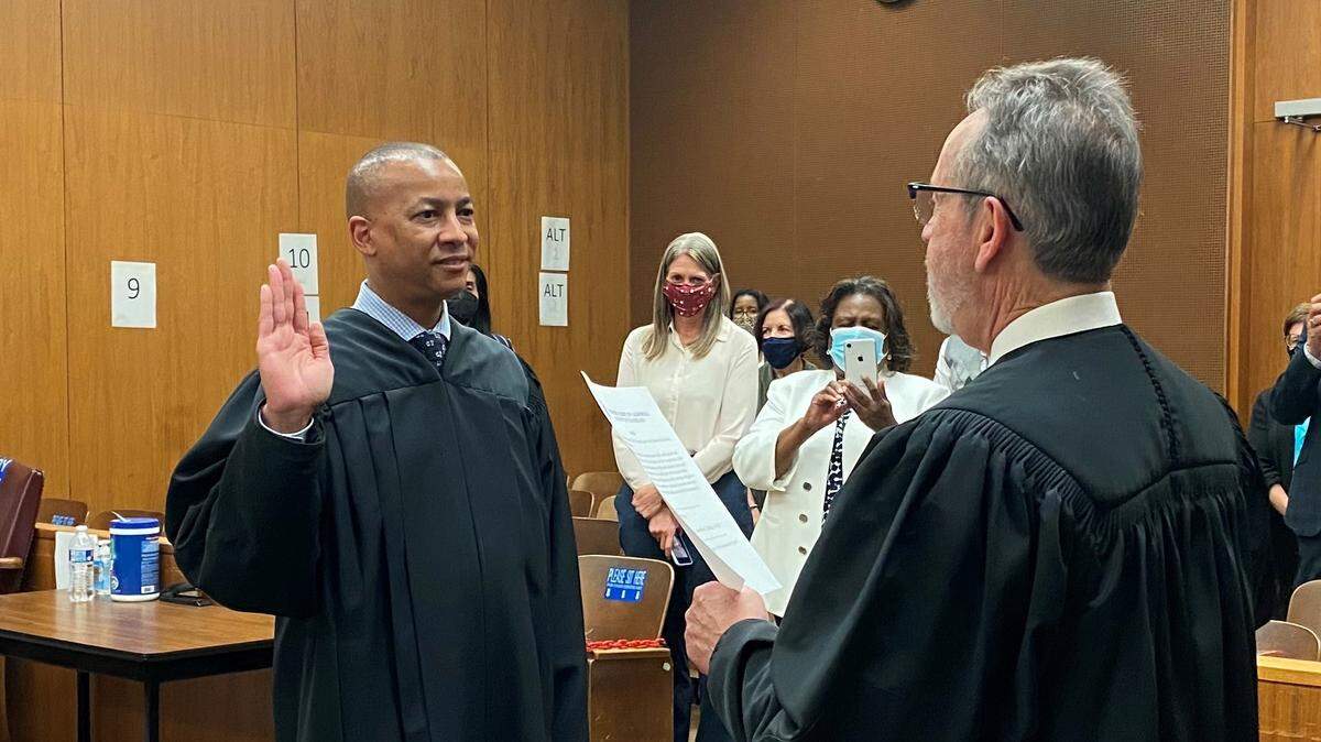 Judge Ricardo Cordova (right) administers the oath of office to Judge Marcus L. Mumford (left) on Friday, May 14.