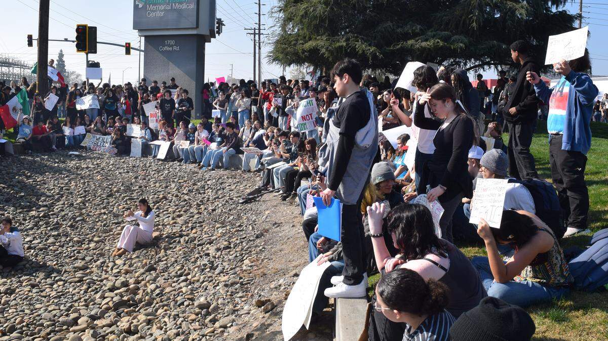 A crowd made primarily of Modesto high school students gathers on Coffee Road in Modesto. 
Anti-ICE youth activism in Stanislaus is inspiring to see.