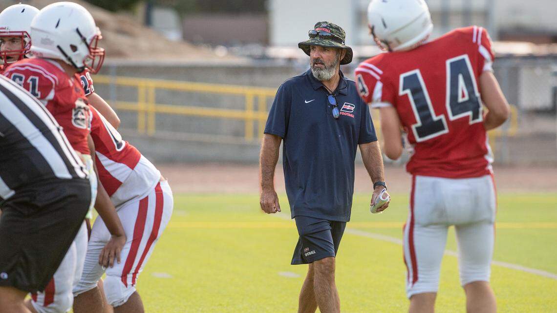 Beyer coach Mike Young watches the defensive team during a pre-season scrimmage at Downey High School in Modesto, Calif., on Friday, Aug. 13, 2021.