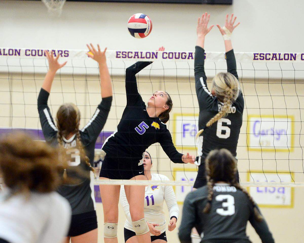 Escalon’s Emily Vickers (5) spikes the ball during a CIF San-Joaquin Division III Girls Volleyball Playoffs game between Escalon High School and Ponderosa High School at Escalon High School in Escalon CA on November 1, 2022. Escalon won the match 3-2.