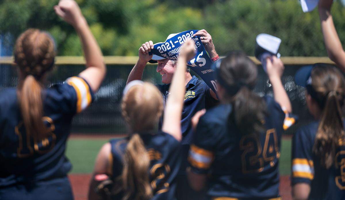 Big Valley Christian coach Eric Layman holds the section championship banner after winning Sac-Joaquin Section Softball Division VII championship game over Stone Ridge Christian at Delta College in Stockton, Calif., on Saturday, May 21, 2022.