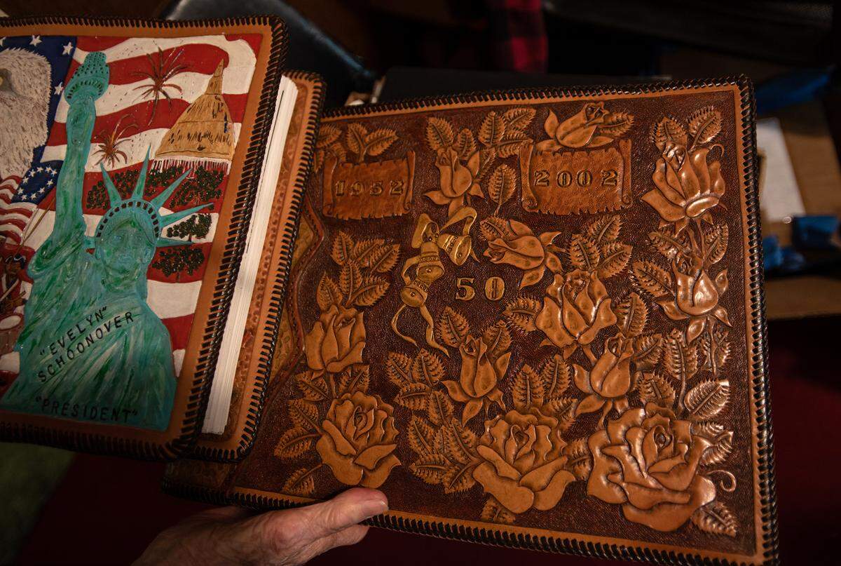 Ed Schoonover, a leather craftsman, made a photo album for his wife Evelyn on their 50th anniversary, filled with pictures of their life together.