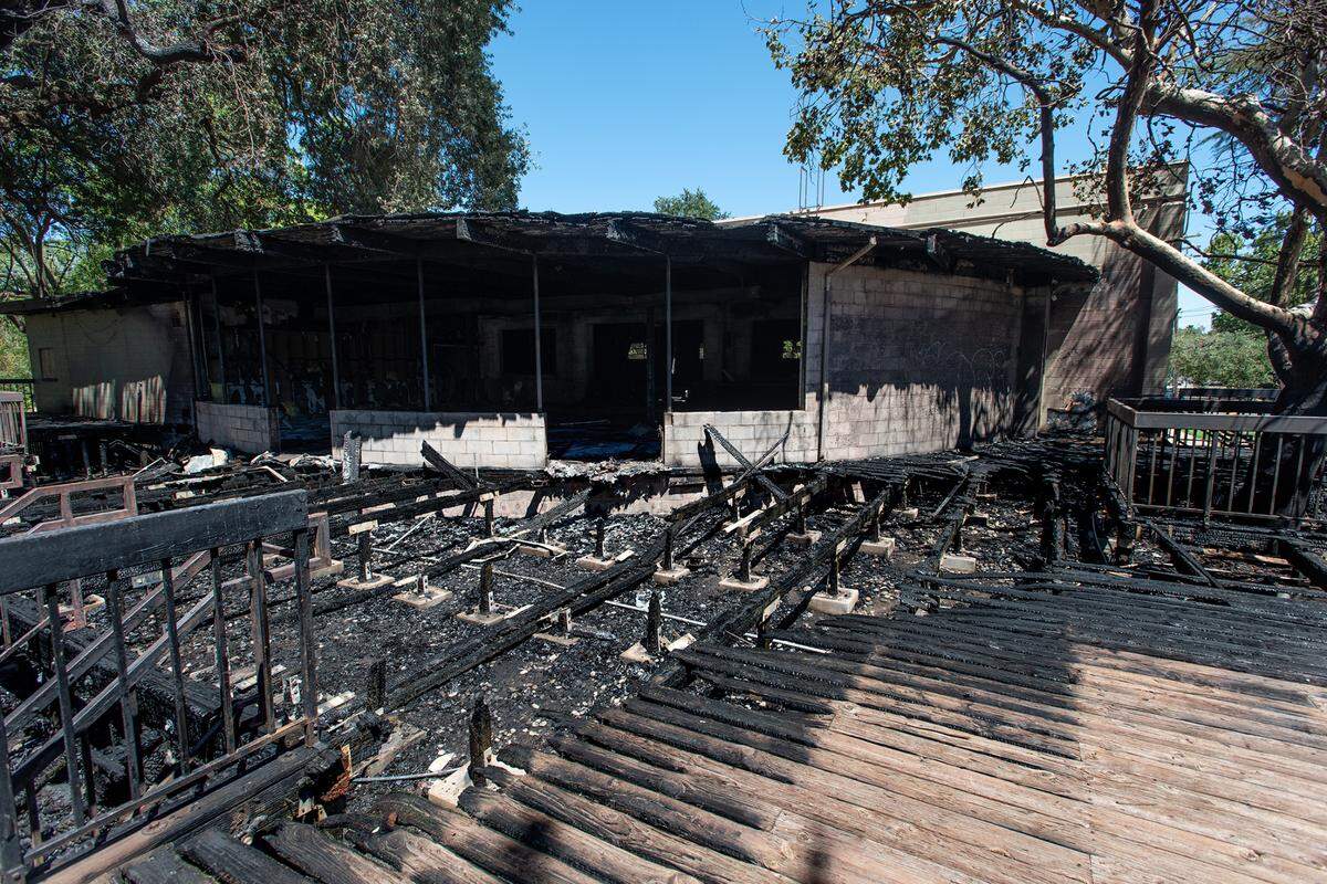 An early morning fire gutted the American Legion Memorial Hall in Tuolumne River Regional Park in Modesto, Calif., on Thursday, July 21, 2022.