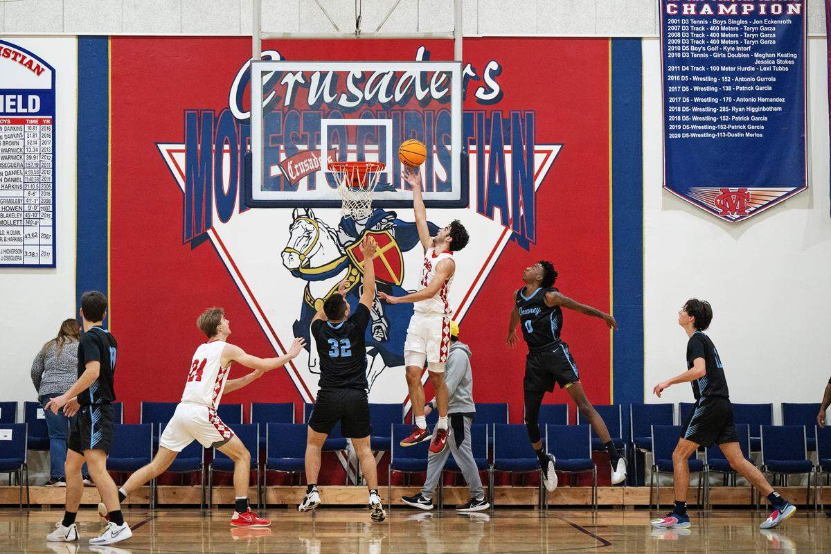 Campolindo’s Dylan Mansour scores on a layup during the Holiday Hoop Classic game with Downey at Modesto Christian High School in Salida, Calif., Wednesday, Dec. 27, 2023.