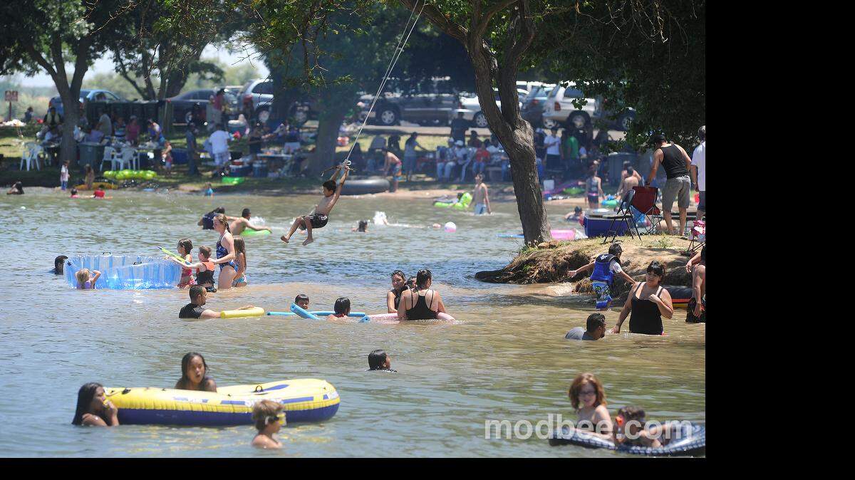 Crowds will once again be able to take advantage of the water and shady trees surrounding Woodward Reservoir, as seen in this June 2013 photo.