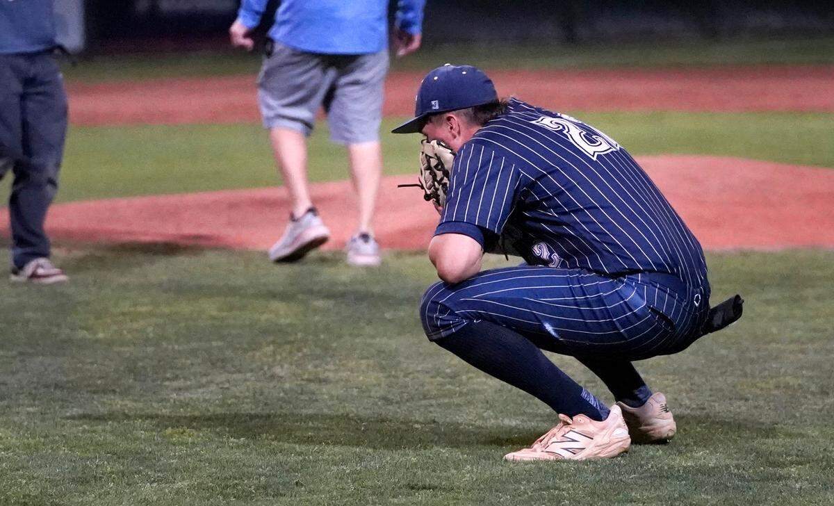 Central Catholic’s Kayden McHenry puts his face in his glove after the game-winning run crosses home in the Sac-Joaquin Section D-III championship game with Yuba City at Sacramento City College on Wednesday, May 21, 2025.