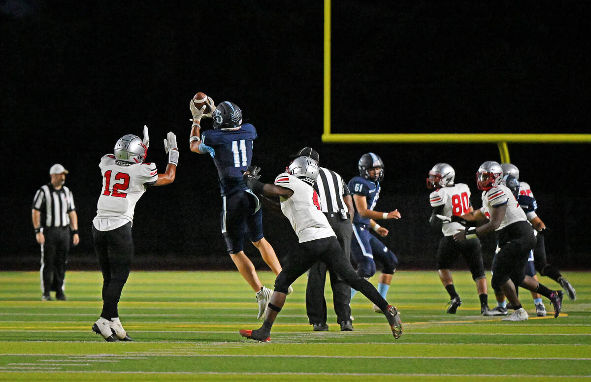 Downey’s Ethan Woodmansee makes a catch during the game with Lincoln at Downey High School in Modesto, Calif., Friday, August 18, 2023.