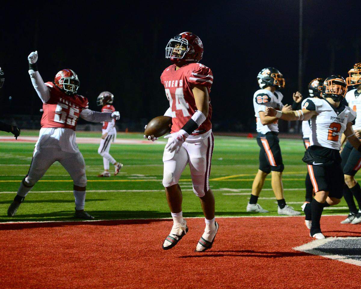 Patterson running back Lolo Mataele skips into the end zone for a touchdown during a CIF Division III Sac-Joaquin Section football playoff game against Roseville at Patterson High School in Patterson, California, on Nov. 11, 2022. Patterson won 56-34.