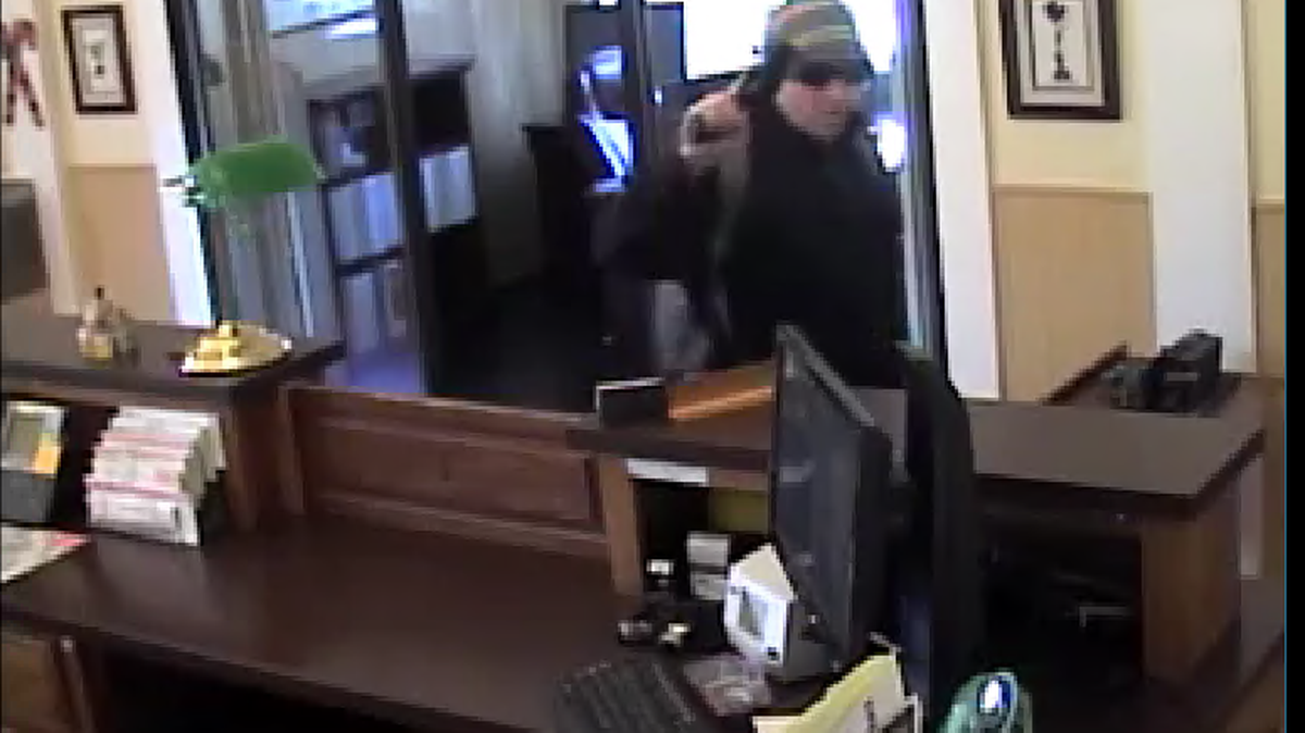 Security camera image of an armed man on Tuesday afternoon (Dec. 5, 2017) robbing Yosemite Bank on Main Street in Groveland, California.