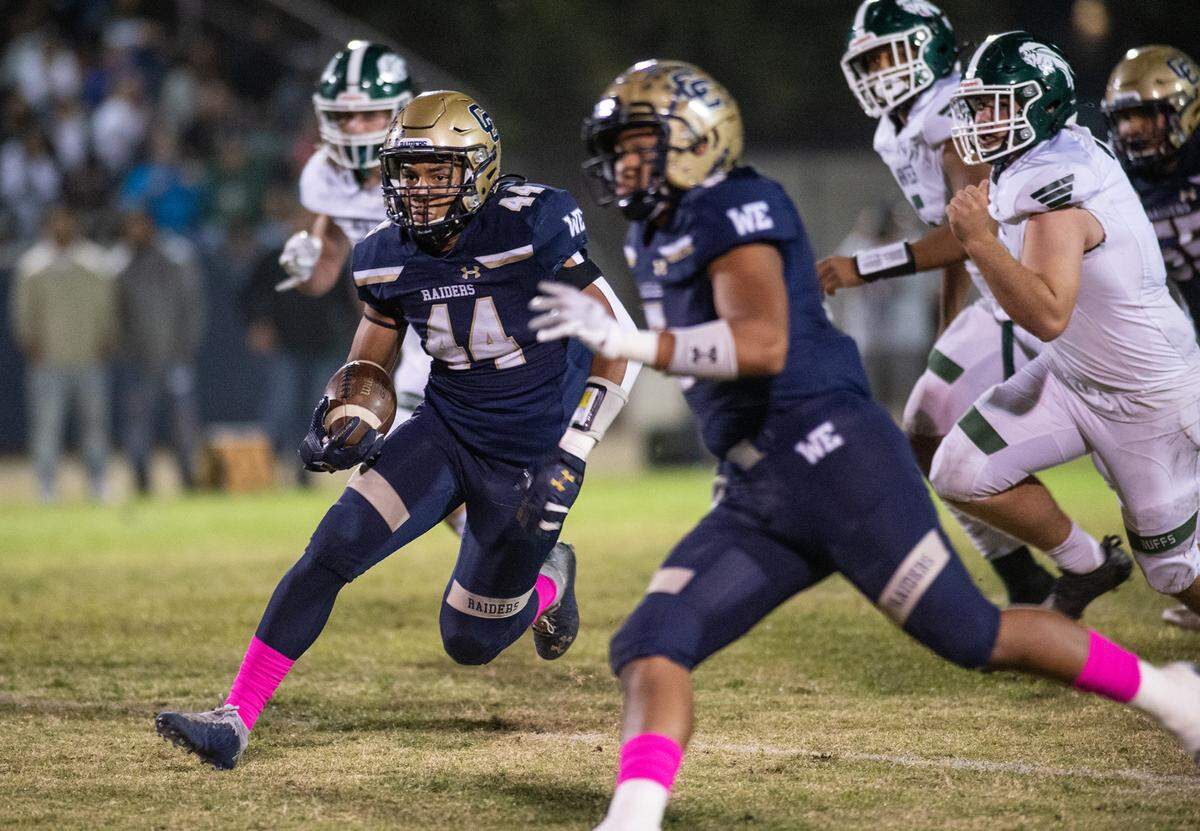 Central Catholic’s Aiden Taylor breaks out on first quarter touchdown run during the Valley Oak League game with Manteca at Central Catholic High School in Modesto, Calif., on Friday, Oct. 15, 2021. Central Catholic won the game 56-33.