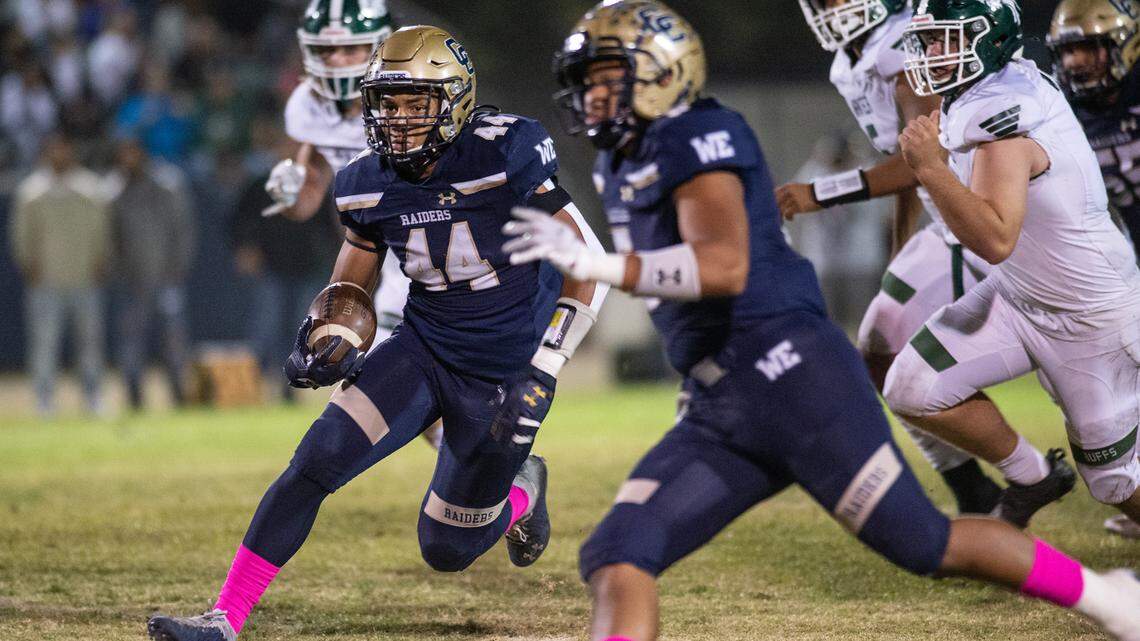 Central Catholic’s Aiden Taylor breaks out on first quarter touchdown run during the Valley Oak League game with Manteca at Central Catholic High School in Modesto, Calif., on Friday, Oct. 15, 2021. Central Catholic won the game 56-33.