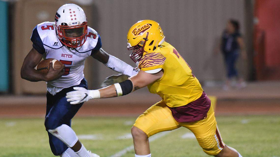 Beyer High running back, Darius Murphy gets away from Los Banos linebacker, Adrian Atangan Friday night, Sept. 20, 2019 at Loftin Stadium in Los Banos. Final score was 14-7 Beyer.