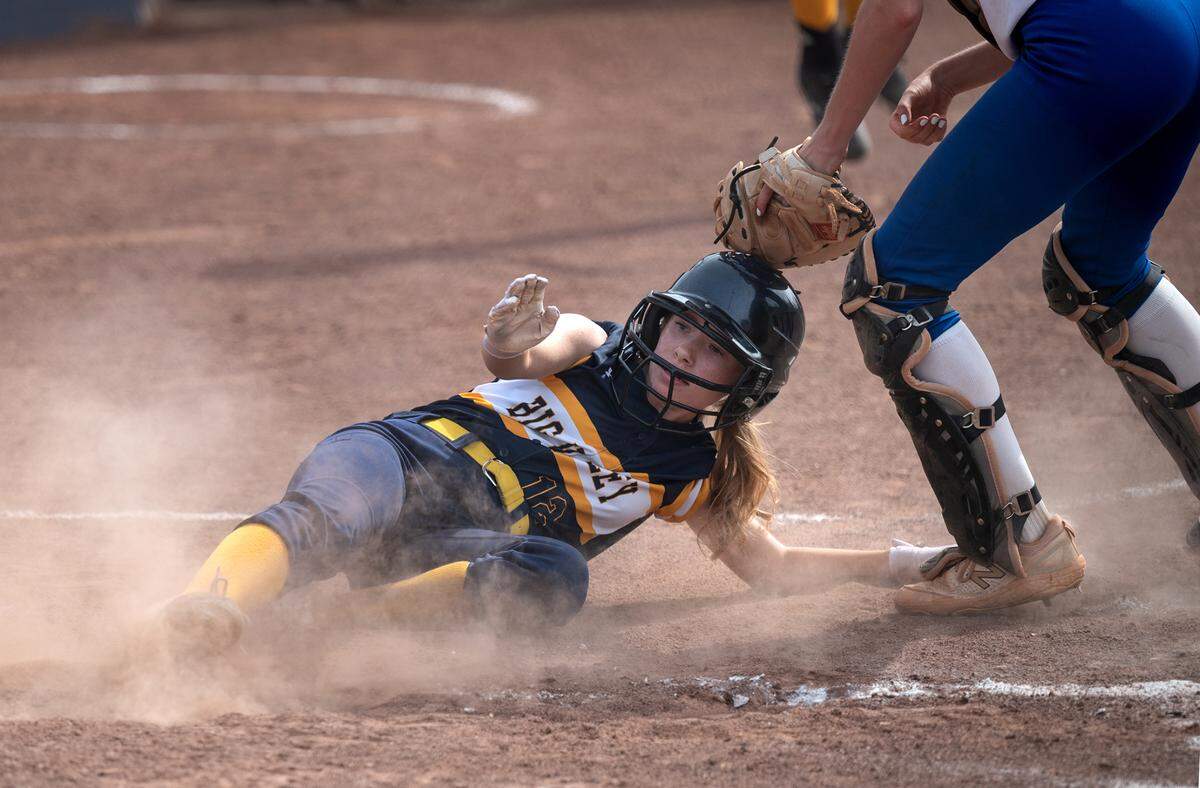 Big Valley’s Olivia Nelson slides home for the Lions’ first run during the CIF NorCal Softball Championship game with Los Altos at Big Valley Christian High School in Modesto, Calif., on Saturday, June 4, 2022.