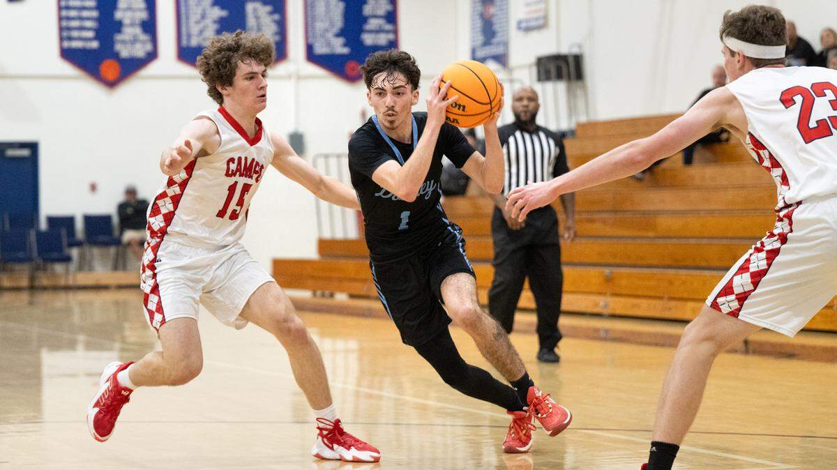 Downey’s Jayden Coelho attacks the basket during the Holiday Hoop Classic game with Campolindo at Modesto Christian High School in Salida, Calif., Wednesday, Dec. 27, 2023.