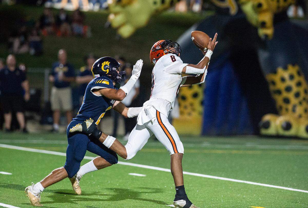 Merced’s Enoch Evans makes a touchdown reception as Gregori’s Ayden Powers defends during the non-league game at Gregori High School in Salida, Calif., on Friday, August 26, 2022.