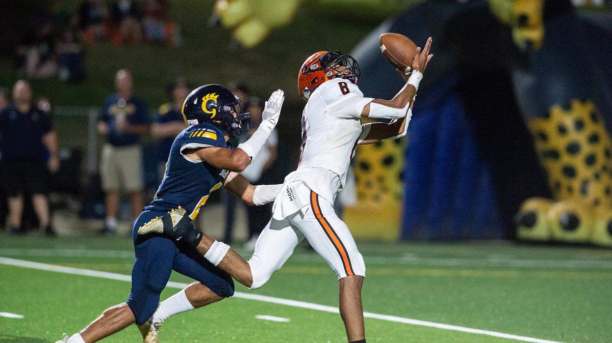 Merced’s Enoch Evans makes a touchdown reception as Gregori’s Ayden Powers defends during the non-league game at Gregori High School in Salida, Calif., on Friday, August 26, 2022.